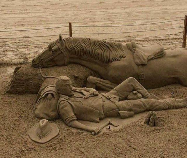 Sand sculpture of man & his horse.